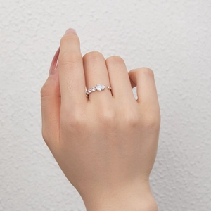 Detail of S925 silver snake wrap ring featuring a pear cut zircon and small side stones