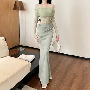 Detail of light green off-shoulder mesh top paired with a silky satin mermaid skirt