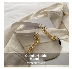 Detail of white leather shoulder bag with gold chain strap and pleated design