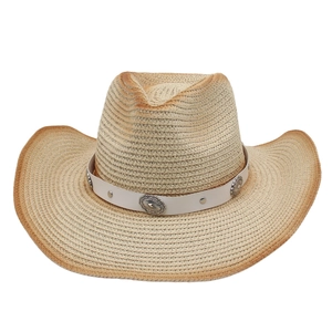 Detailed close-up of woven panama straw hat with retro metal conchos and leather band