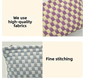 Close-up of premium knit checkerboard fabric and refined stitching on makeup bag