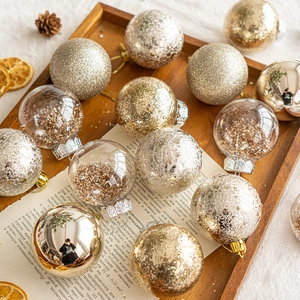 Set of 15 gold and silver Christmas ball ornaments on a rustic wooden tray with pine cones