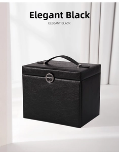 Close-up of elegant black jewelry organizer box featuring textured leather and silver lock