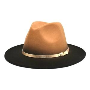Detail of two-tone gradient fedora with brown crown, black brim, and gold buckle band