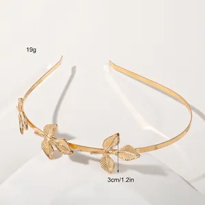 Detail of golden metal leaf headband showing 19g weight and 3cm leaf height