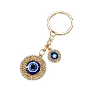 Vintage golden evil eye keychain with heart-shaped pendants and sparkling blue rhinestones