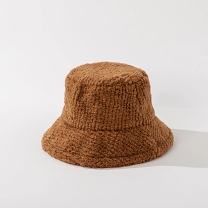 Detail shot of plush brown faux shearling bucket hat with warm textured fleece fabric