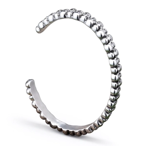 Punk style silver skull relief cuff bangle with open C-shape design in vintage metal finish