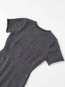 Detailed view of dark grey knitted fabric texture on short sleeve mini dress