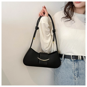 Side view of black PU leather baguette bag with golden crescent buckle and thin shoulder strap