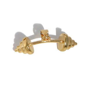 Detailed close-up of a gold dumbbell pendant with a polished stainless steel finish