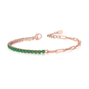 Detail of rose gold paperclip chain and green zircon tennis bracelet with lobster clasp