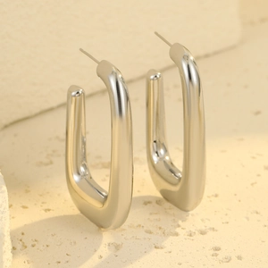 Modern U-shaped thick hoop earrings in polished silver finish for a minimalist style