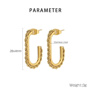 Detailed macro of gold twisted rope U-shaped stainless steel earrings 28x4mm