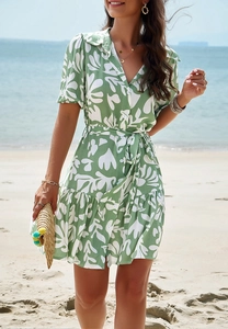 Short sleeve button-down shirt dress featuring a green geometric print and waist tie