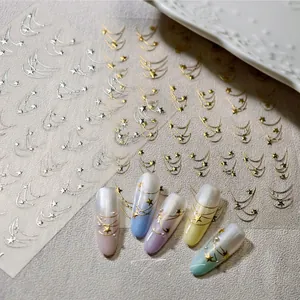 Close-up of golden star and moon nail stickers applied on gradient press-on nails