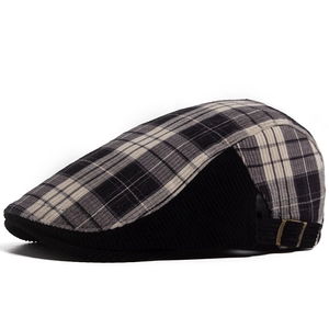 Vintage plaid newsboy cap in corduroy with adjustable metal buckle and retro grid pattern