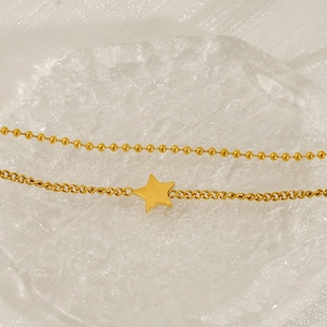 Double-layered stainless steel star bracelet with gold bead and twisted chain