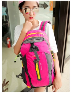 Outdoor large capacity backpack in rose red and grey shown on model for size perspective