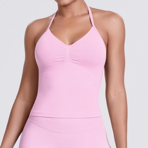 Detail of pink seamless knitted yoga tank top with ruching and ribbed texture
