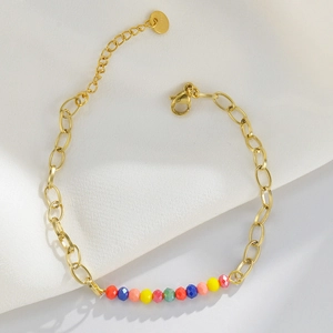 14k gold plated stainless steel bracelet with colorful faceted beads and silk background