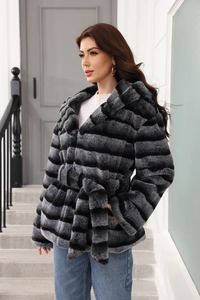 Close-up of women's hooded faux fur coat with black and grey stripes and matching waist belt