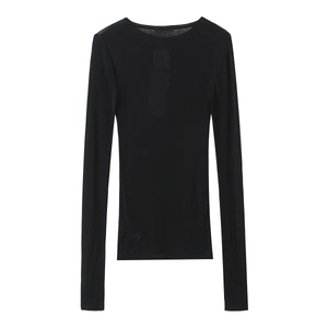 Detail of black long sleeve t-shirt showing sheer knitted texture and ribbed neckline