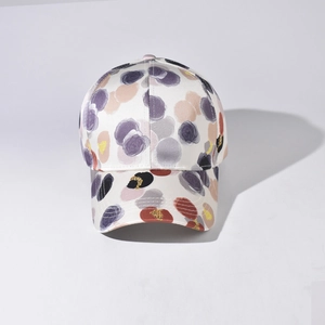 Detail of colorful abstract polka dot pattern on an off-white baseball cap