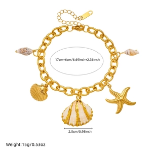 Gold ocean themed stainless steel bracelet with starfish and seashell charms on white background
