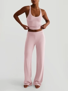 Completo yoga rosa a coste con canotta con dorso a vogatore e pantaloni a gamba larga