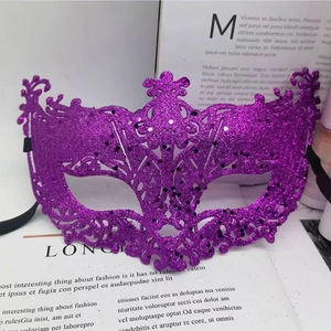 Detail of purple glitter lace cutout mask with black ribbon on a book background