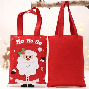 Festive red felt Christmas gift bag with 3D Santa Claus and 'Ho Ho Ho' text on a tree