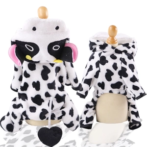 Plush cow pattern dog costume with hood and heart tail on white background