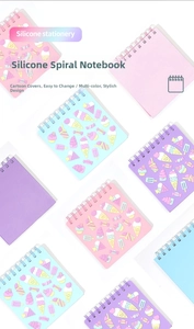 Close-up of colorful cartoon silicone spiral notebooks with 3D dessert decorations