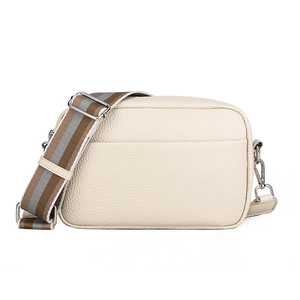 Minimalist beige pebble leather crossbody bag with striped wide fabric shoulder strap
