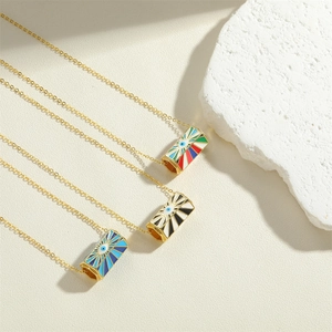 Three gold evil eye cylinder necklaces with red, green, and blue enamel pendants