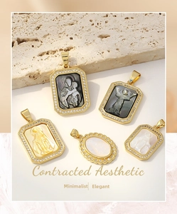 Macro shot of gold-plated Virgin Mary shell pendants with sparkling zircon details
