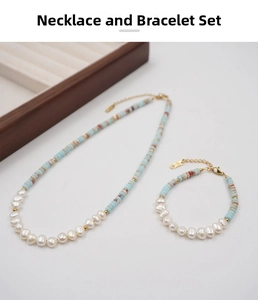 Detailed flat lay of a pearl and turquoise bead necklace and bracelet jewelry set