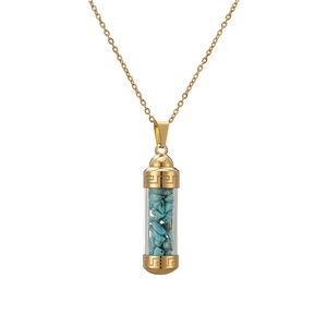 Detail of gold perfume bottle pendant filled with turquoise stones on a chain