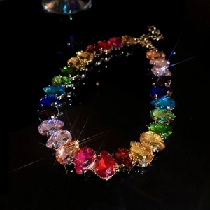 Macro view of luxurious pear-cut rainbow crystals necklace with colorful star-flare sparkle