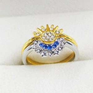 Sparkling gold sun and silver moon celestial rings set with blue and white zircons