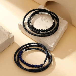 Detail of multi-layer braided leather bracelets with agate beads in black and dark blue