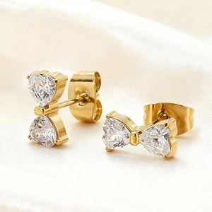 Exquisite 18k gold plated stainless steel bow earrings with sparkling heart zircon stones