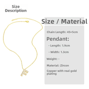 Detailed view of the letter F pendant featuring sparkling zircon pave in gold plating