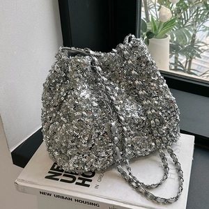 Chic silver sequin bucket bag with metal chain strap for party and evening use