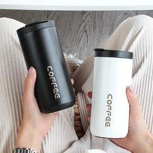 Black and white 304 stainless steel coffee tumblers with insulated lids and printed text