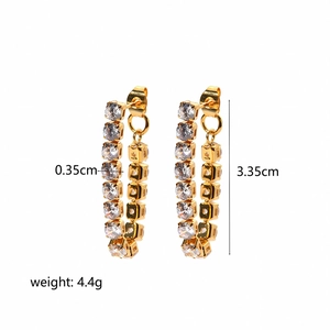 Detail showing 3.35cm 18K gold plated drop earrings with sparkling cubic zirconia pavé