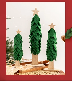 Three green felt Christmas tree desk ornaments with wooden bases and star toppers