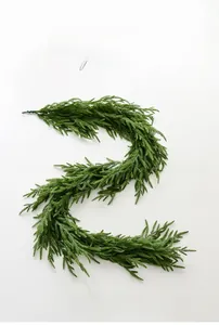Detailed close-up of realistic Norfolk pine garland with flexible soft PE pine needles