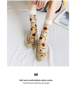 Detail of sheer mesh crew socks with sunflower embroidery and white ribbed cuffs